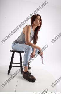14 2020 MOLLY SITTING POSE WITH GUN 2